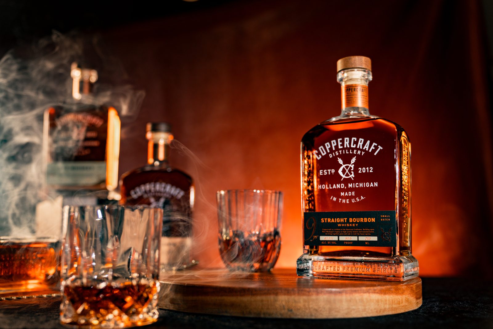 Coppercraft bottles and glasses on a bar